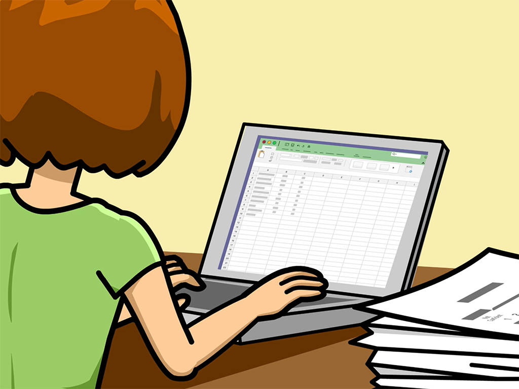 Cassie inputs numbers into a spreadsheet on a computer.